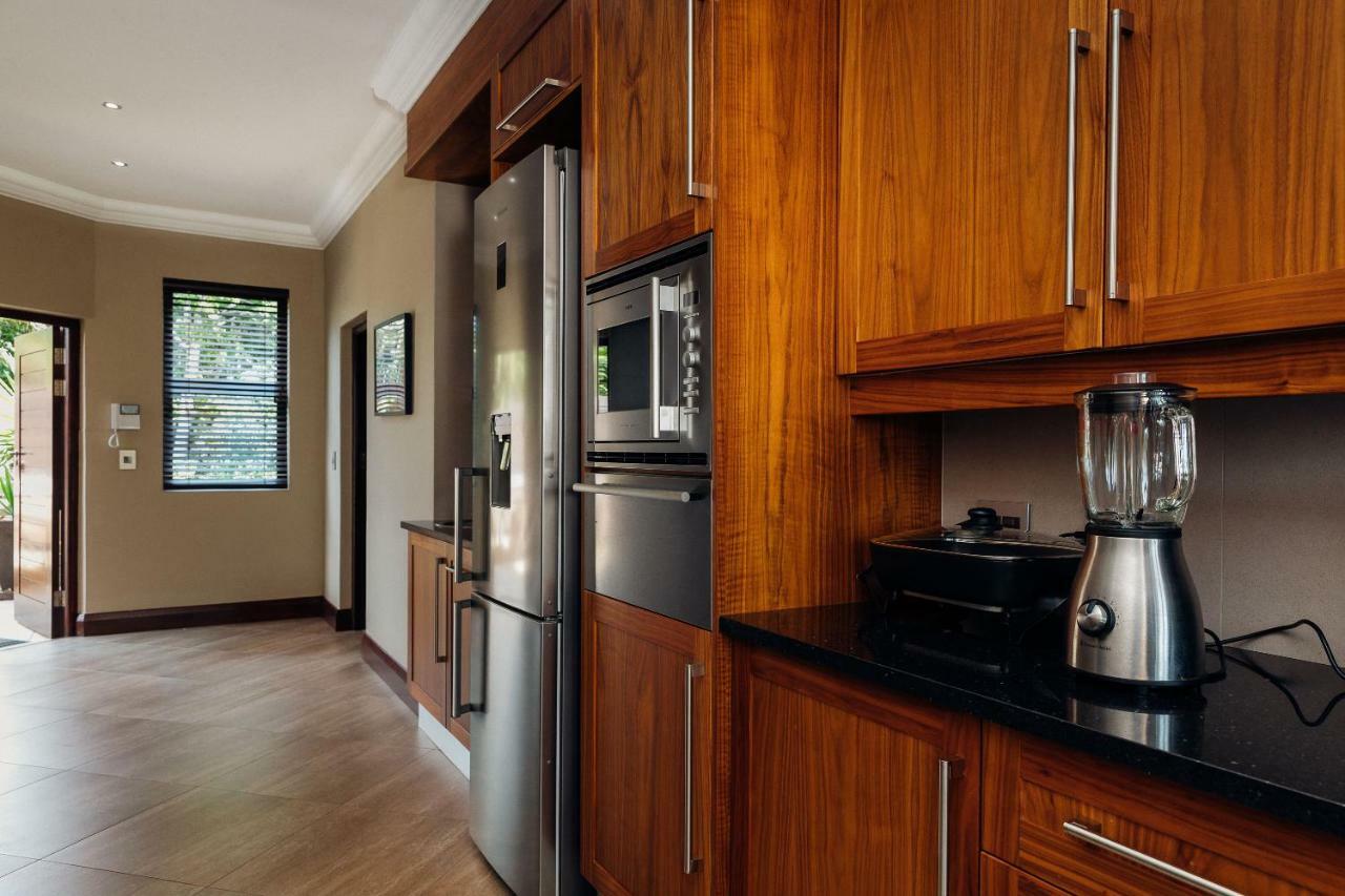 Open-plan kitchen with wood cabinetry