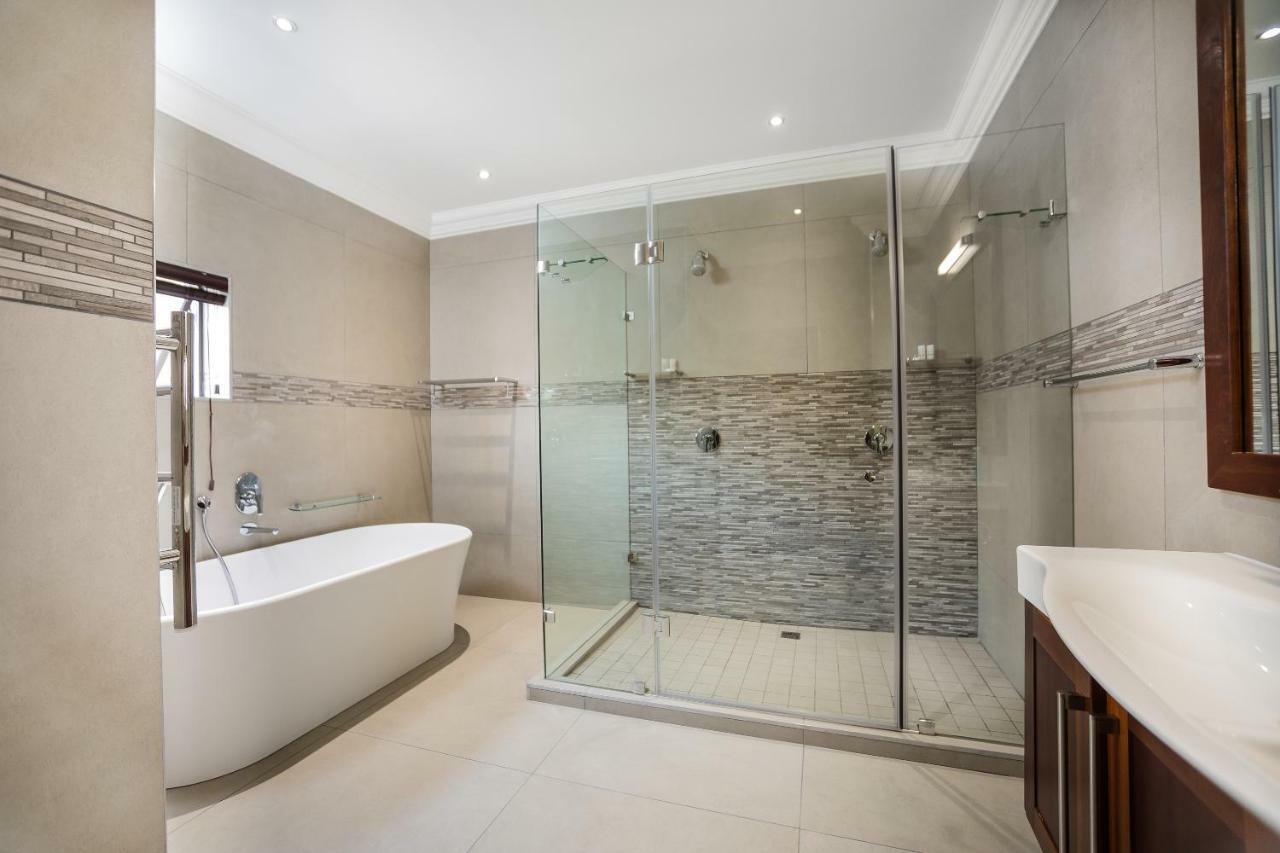 Tjailatyd en-suite bathroom with freestanding bath and glass shower